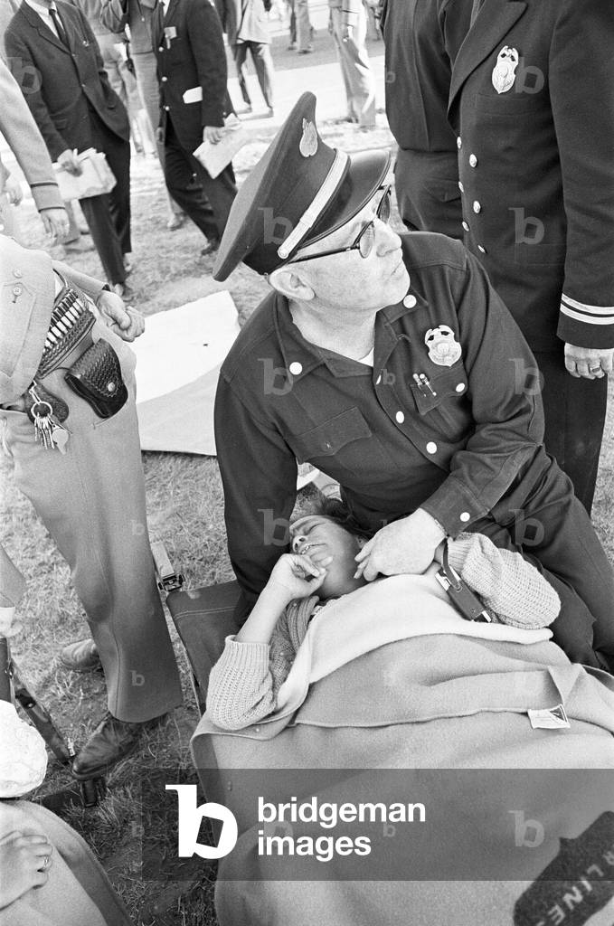 The Beatles 1964 American Tour San Francisco. (Picture shows) A young fan on a Stretcher at one of the Casualty station's. 18th August 1964 (b/w photo)
