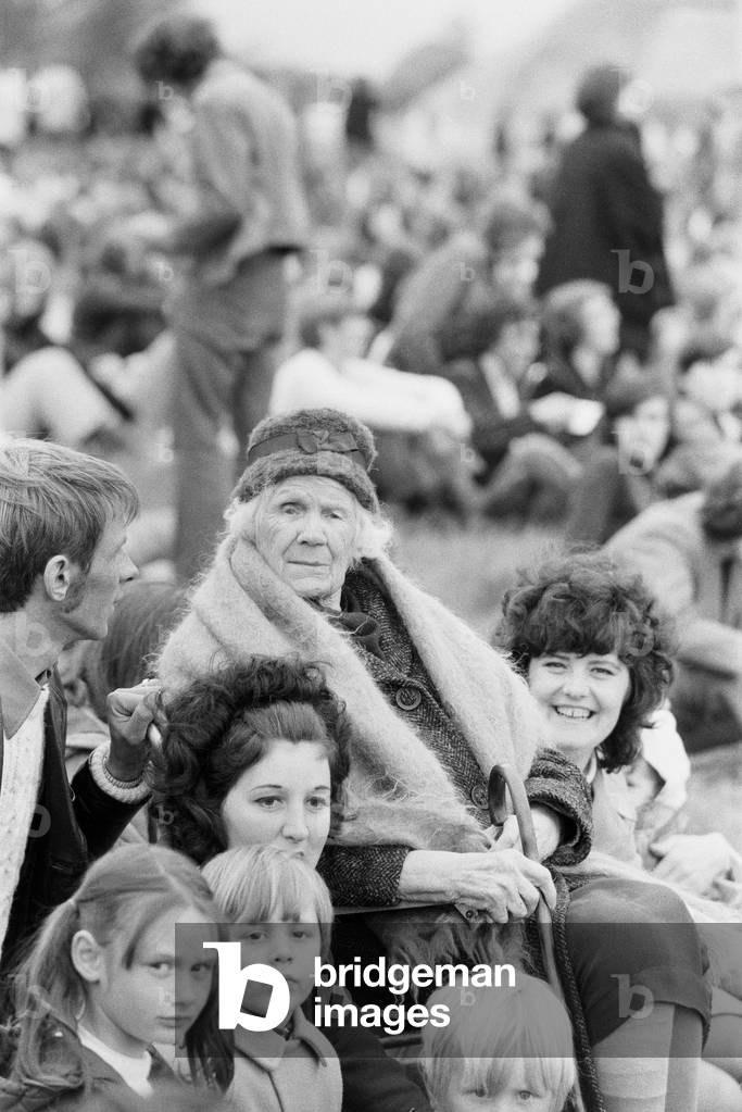 Reading Pop Festival, 88 year old pop fan Mrs Edith Gregory of Compton, Berkshire watching to see her grandson Graham Gregory play in the Amada group, 26th June 1971 (b/w photo)