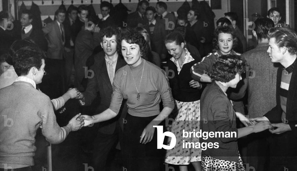 Teenagers dancing at the St John youth club. 18th December 1958 (b/w photo)