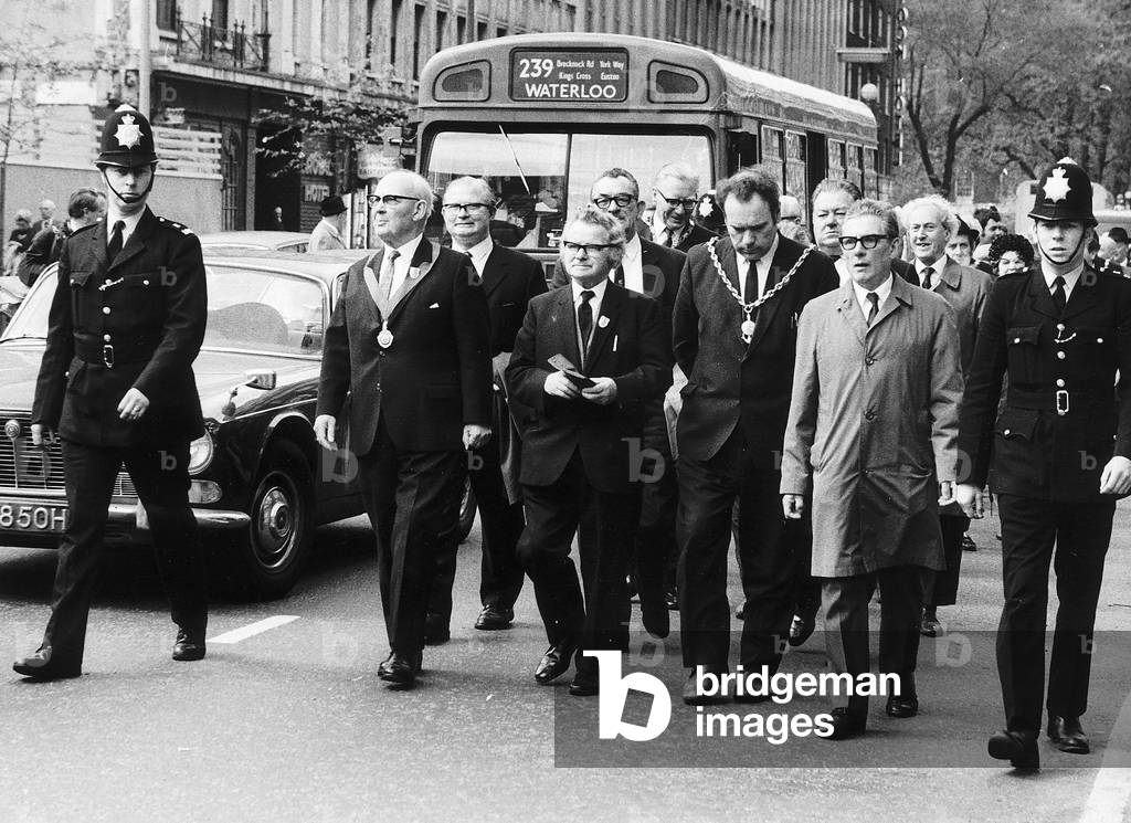 Paddy Scullion (2nd left front) with civic leaders from 22 towns march in London to hand a protest letter to the Prime Minister 10th May 1972 (b/w photo)