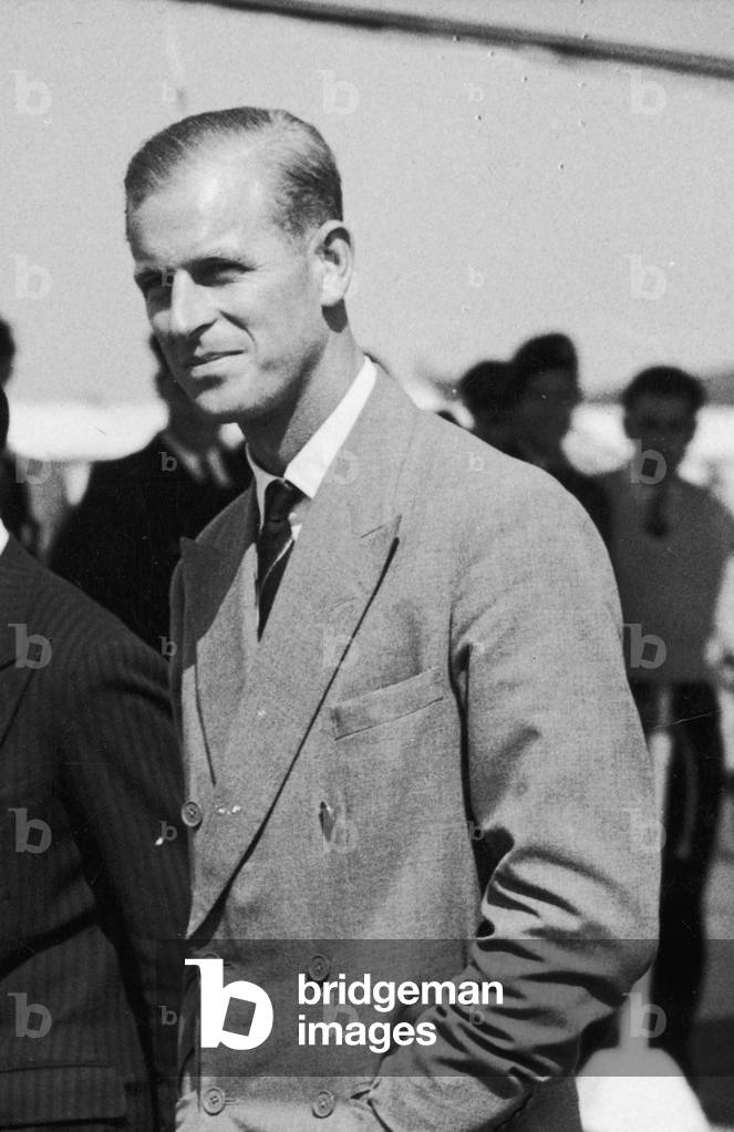 The Duke of Edinburgh arrives home on leave. Pictured with his private secretary Mike Parker, 1950 (b/w photo)