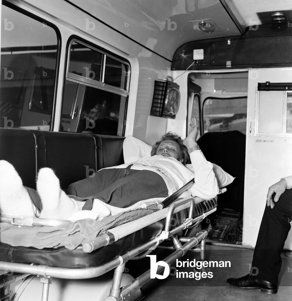 Stuntman Evel Knievel leaves hospital in London. 10th June 1975 (b/w photo)