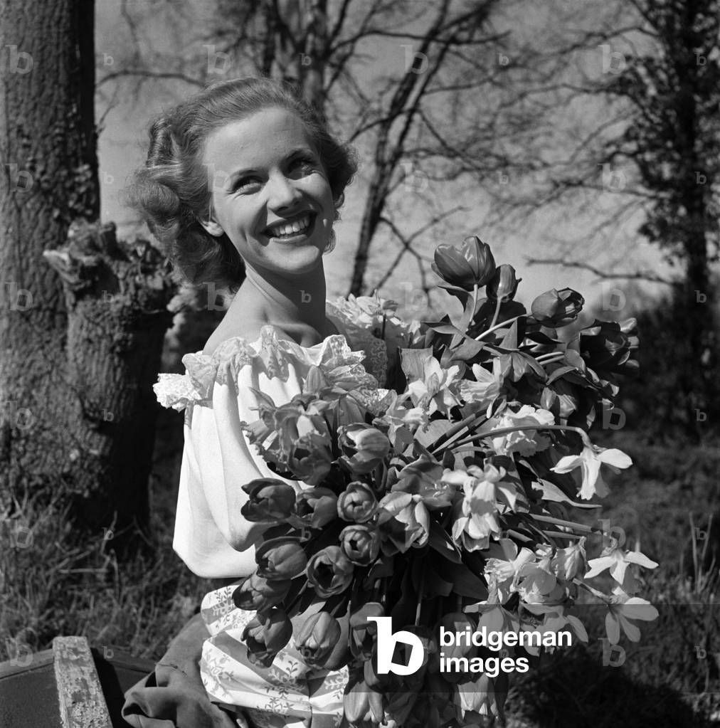 Actress Honor Blackman seen here with flowers in the gardens of Pinewood studio. March 1948 O12241-001