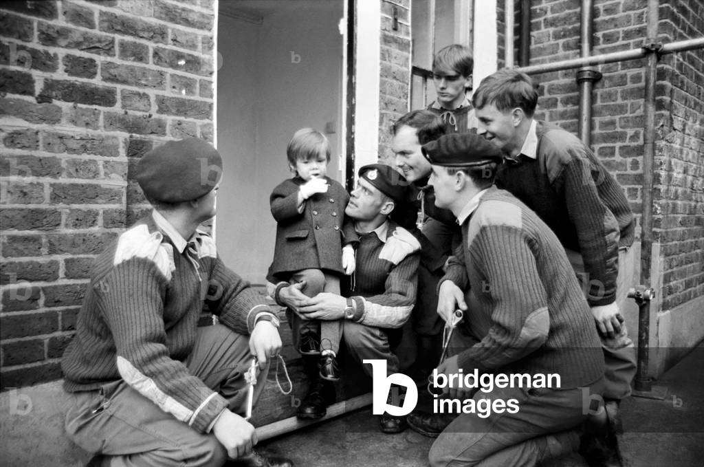 Mark Diment meets the six marines who are working on his special play area, at the Chancellor Grove, West Norwood home where he will soon be moving. November 1969