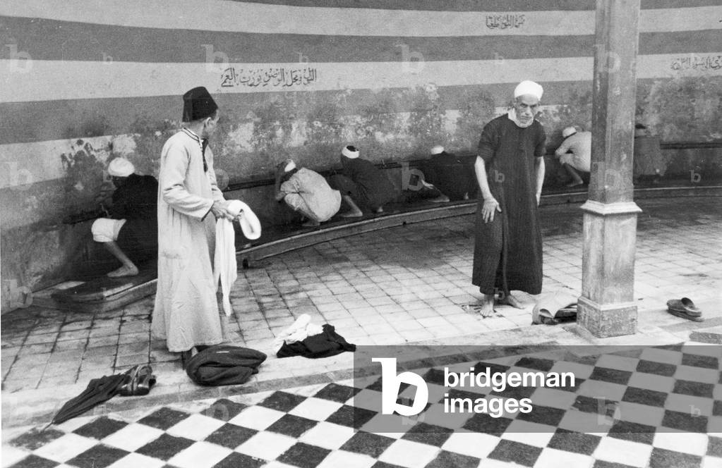 Friday Prayers in Port Said, Eygpt. Our picture shows; those about to pray in the Abbas Mosque, Port Said, going through the three fold washing process as laid down by the Koran, before entertaing the mosque. June 1936