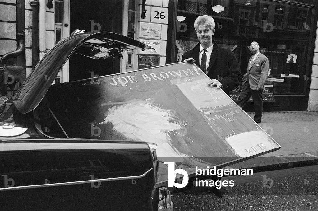 Singer Joe Brown collects a picture of himself from Portal Gallery, Grafton Street, W1. 5th July 1962 (b/w photo)