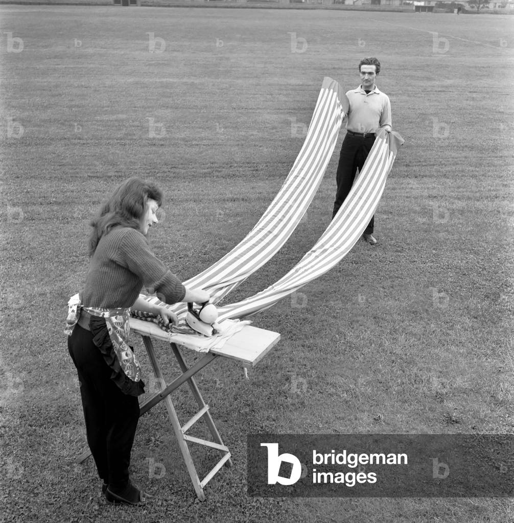 Entertainment: Circus: Barrie Sloan, Billy SmartÍs stilt walker seen here washing and ironing his trousers before a performance. October 1960