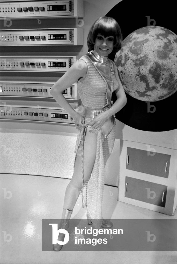 Entertainment Film. Science Fiction series being made for ATV by Century 21 Productions. (Century 21 is Gerry and Sylvia Anderson who made the very successful puppet series, Thunderbirds, Captain Scarlet, etc). There will be seventeen epidoses, and the budget is £100,000 per episode. For a change there is no American money in the production. The story is basically about S.H.A.D.O. (Supreme Headquarters Alien Defence Organisation), a sort of United Nations of the space age, against the mysterious aliens in their UFO's. (Unidentified Flying Objects) to the uninitiated. Our Picture Shows: Actresses on the Moon base set. October 1969 Z10450-002