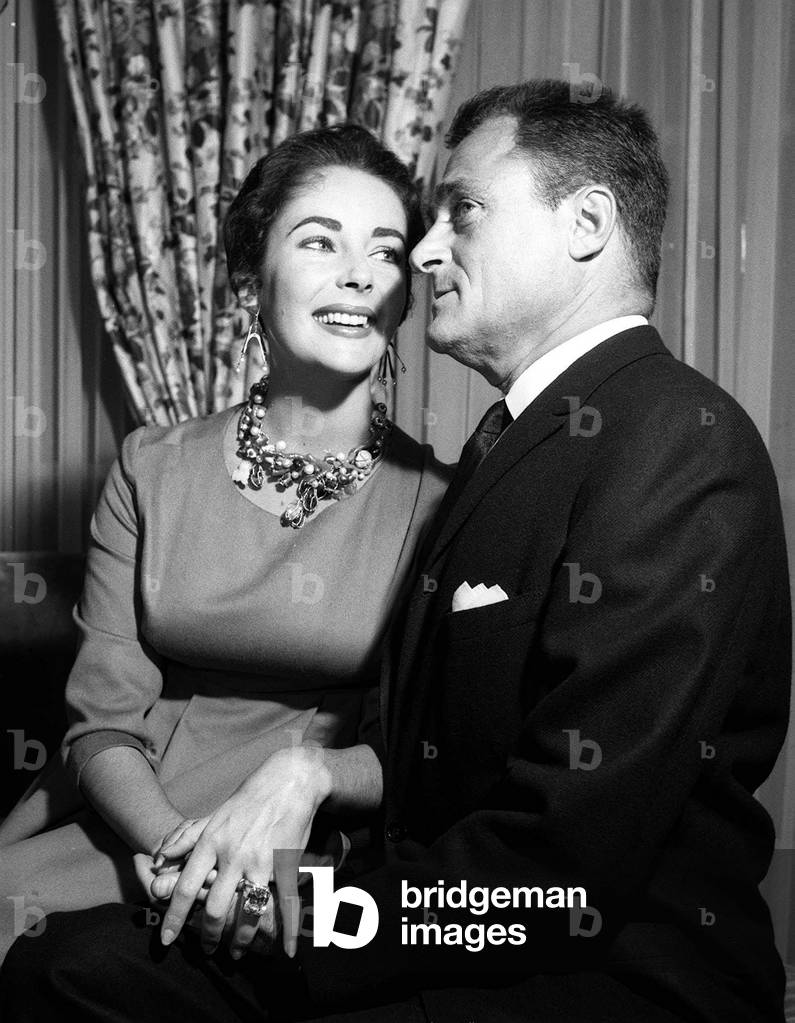 Elizabeth Taylor with Husband Mike Todd showing off her diamond ring, April 1957 (b/w photo)