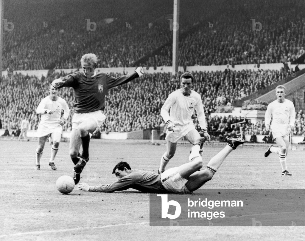 FA Cup Final 1963 Manchester United v Leicester City. Denis Law beats Gordon Banks the Leicester goalkeeper to only to choke and miss an open goal during the FA Cup final at Wembley 25th May 1963 (photo)