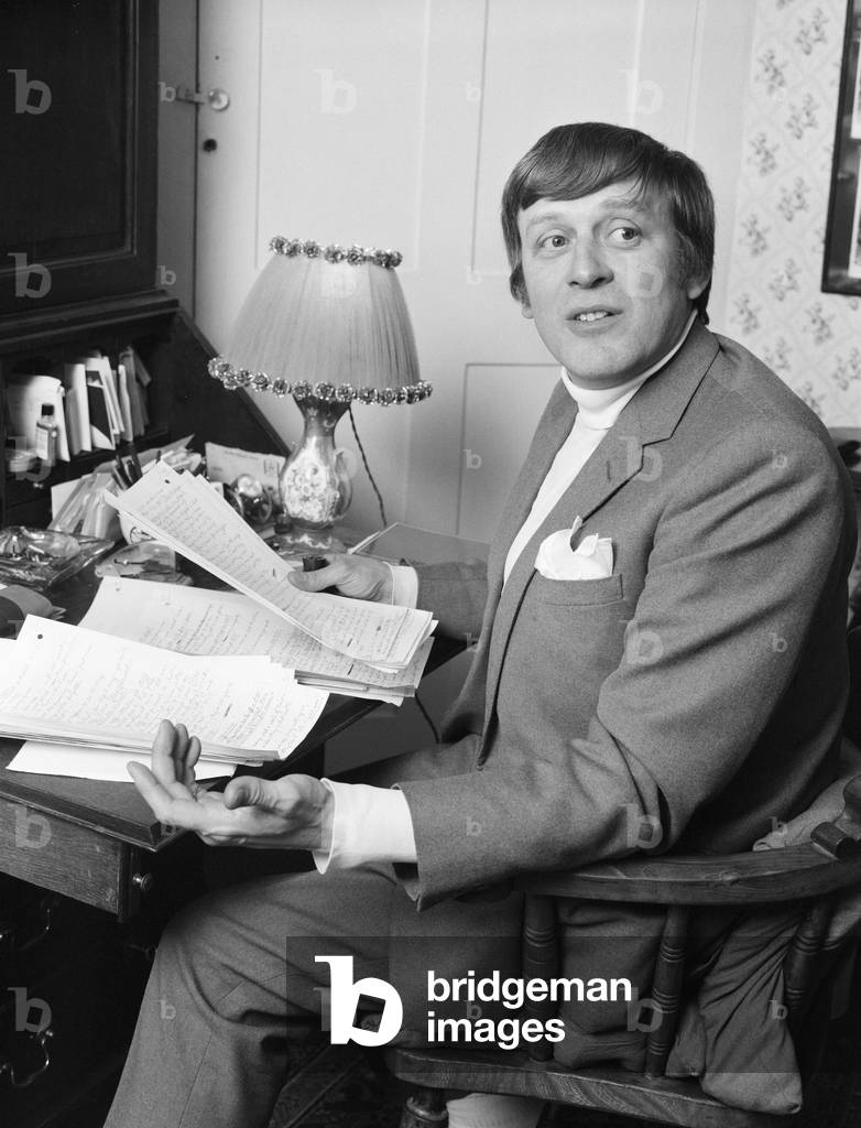 Jimmy Perry, Scriptwriter, pictured working on Dads Army scripts, at home in Westminster, London, 9th April 1969 (b/w photo)