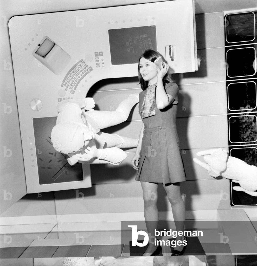 Telecommunication Exhibition at the Design Centre, Haymarket. 24 year old Pamela Houghton with the cordless telephone of the 1990's, in the office of 1990's civil engineer. November 1969