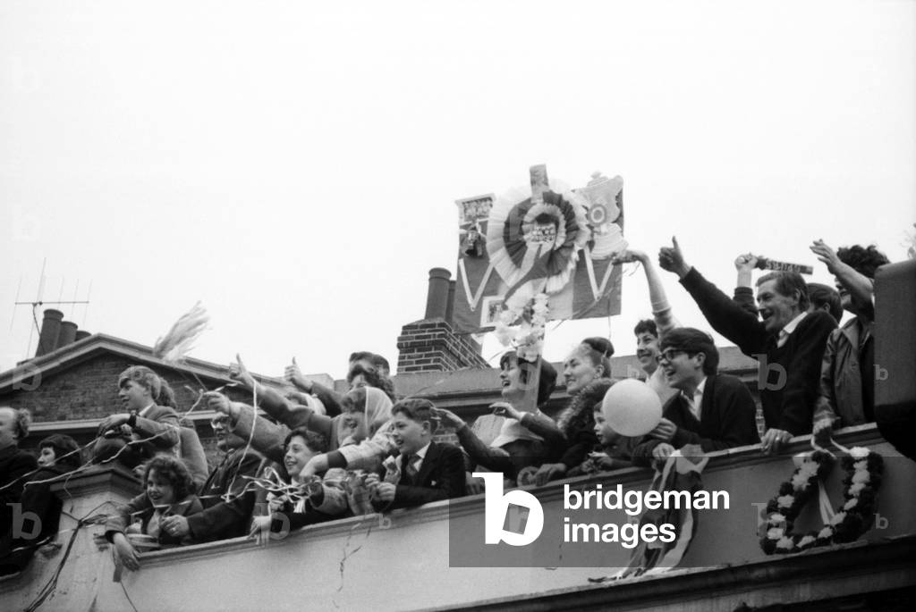 Fans of Tottenham Hotspur wave and cheer as their team arrive home after defeating Burnley 3-1 in the FA Cup Final at Wembley. May 1962 Q3890-013 (photo)