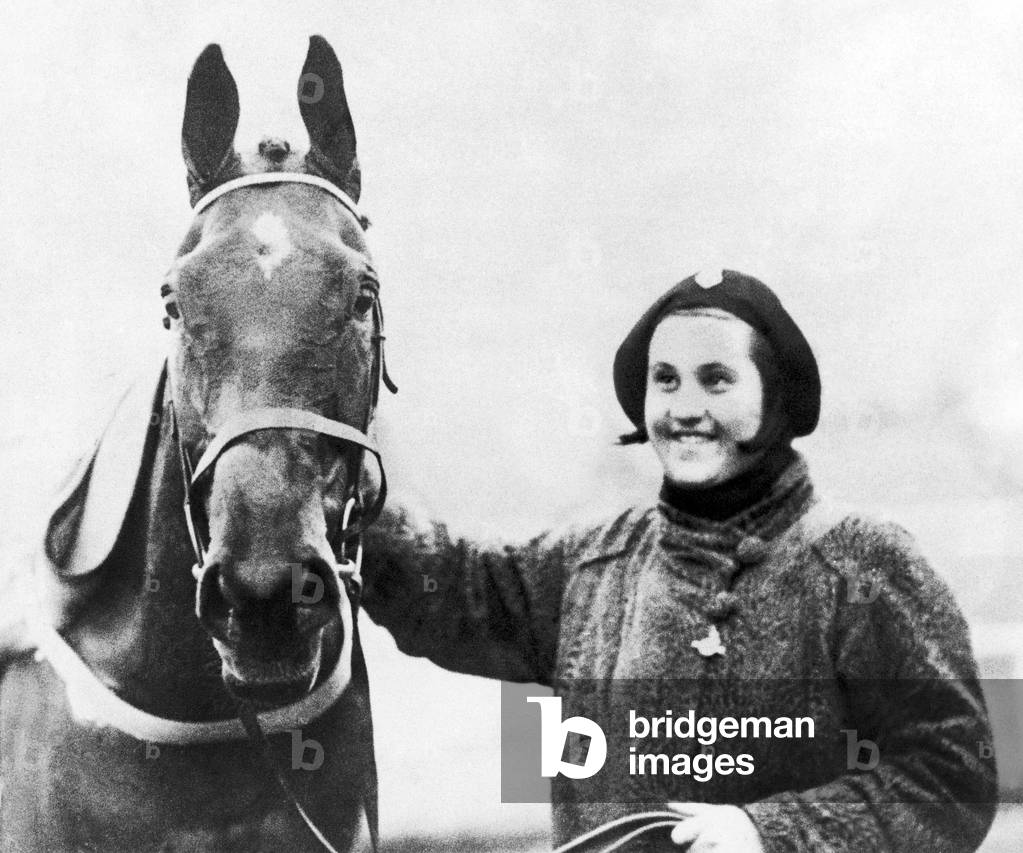 Famous racehorse Golden Miller with owner Dorothy Paget after winning the 1934 Grand National at Aintree. March 1934 (b/w photo)