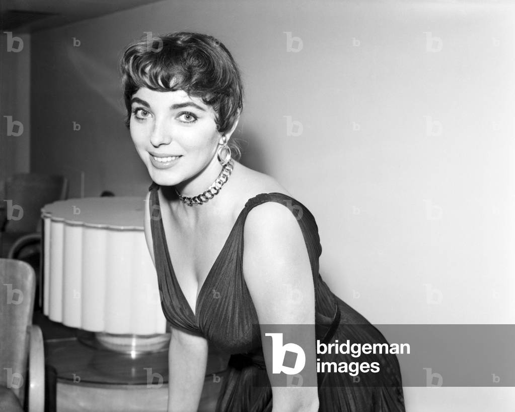 Joan Collins, actress, pictured at home, with family and friends, London, 4th October 1955.