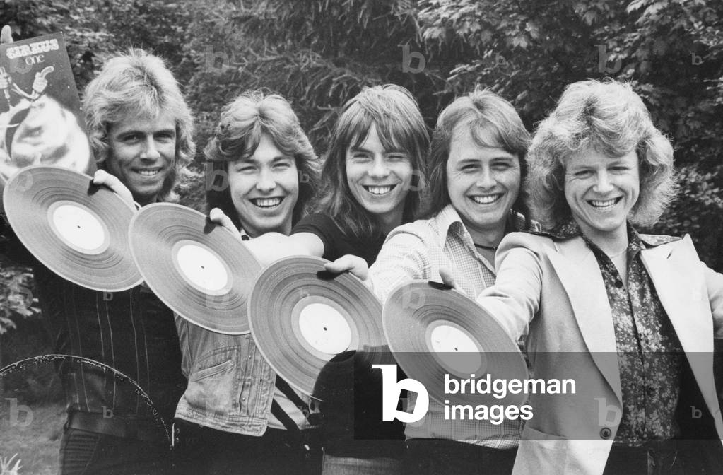 Local seventies band Cirkus (left to right) Paul Robson, Derek Miller, Dog, Stu McDade and John Taylor celebrate their album release 3 July 1975 (b/w photo)