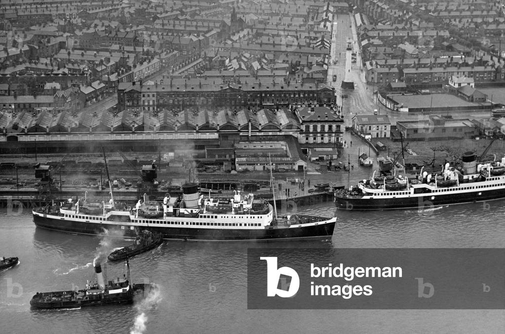 The Isle of Man Steam Packet Co. steamer 'Mona's Isle' which ran aground after colliding with a fishing boat off Fleetwood seen being docked after being refloated.
9th June 1935