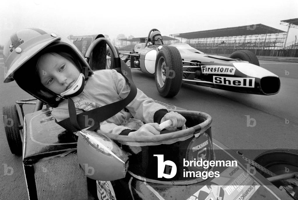 Angela four year old daughter of Ken James seen here at the wheel of her miniature petrol driven racing car February 1975