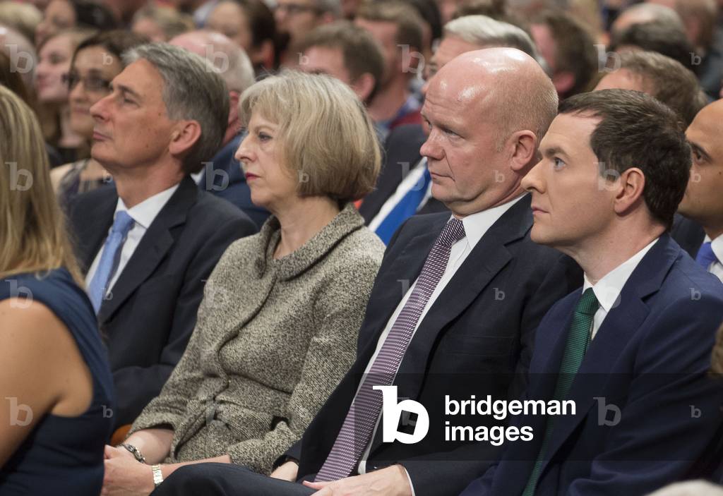 Members of the cabinet including (R-L) Chancellor George Osborne, Leader of the House William Hague, Home Secretary Theresa May and Foreign Secretary Philip Hammond listen as Prime Minister David Cameron gives his keynote speech to the Conservative party conference on October 1, 2014 (photo)