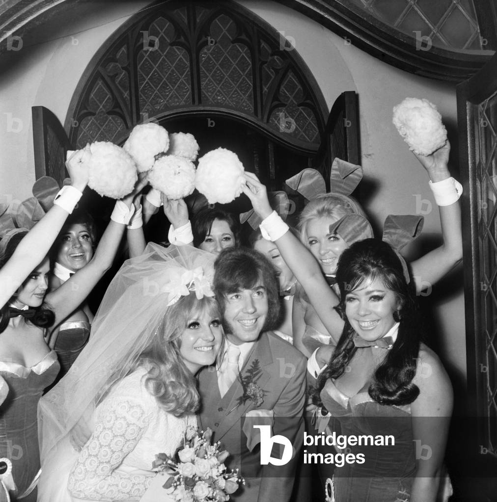 Dave Munden, 26, the Tremeloes pop group drummer was married to 22 yr old Andre Wittenberg a bunny girl from the Playboy Club in London. The wedding took place this afternoon at St. Saviours Church, Warwick Av., after the servive they walked under an arch made up of Bunny girls holding up bunny tails. The reception was held at the Lord Taverners Room is next to Lords Cricket Ground. The Bride and groom leave the Church under the arch of Bunny 9 yrs. December 1969