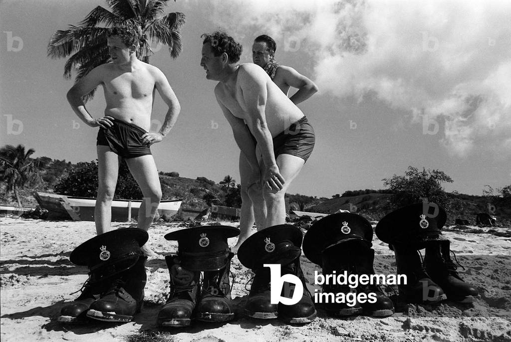 British Policemen on the Caribbean Island of Anguilla August 1969 seen here cooling off with a paddle in the sea