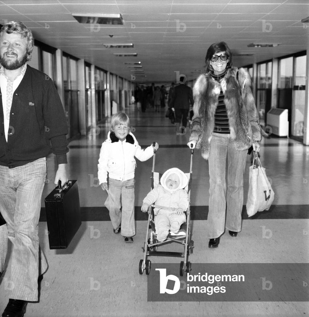 Entertainer Cilla Black seen here at Heathrow Airport with her husband and children, April 1975 (b/w photo)