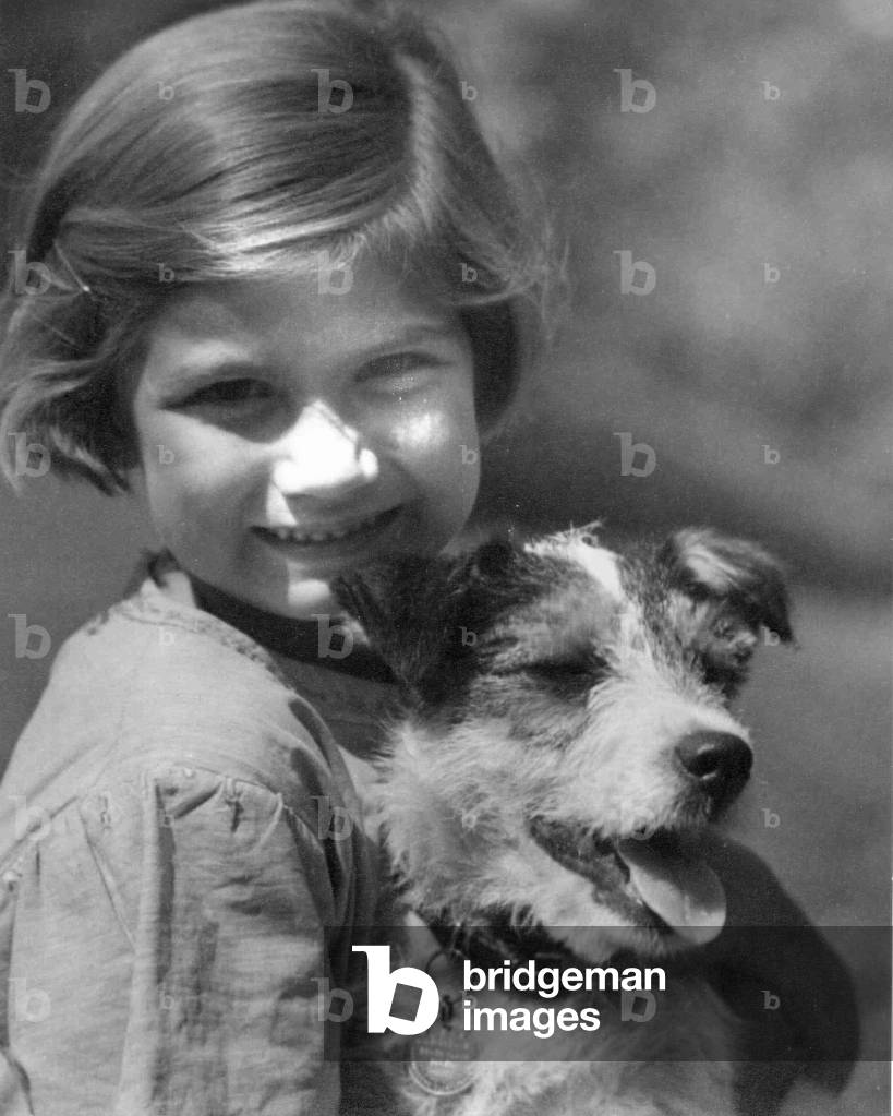 Young girl with pet dog 
Circa 1945