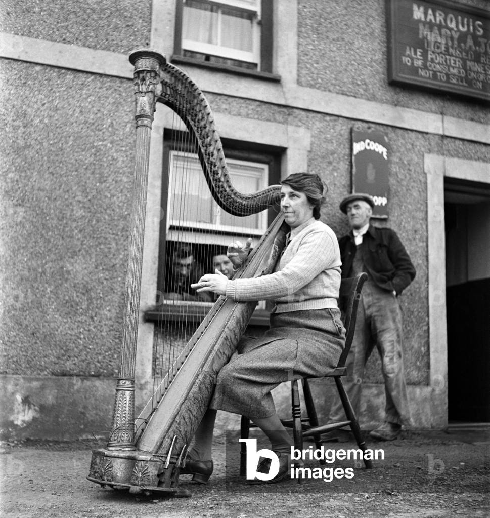Welsh Harpist Marry Anne Jones seen here performing in the street. March 1952 C1118