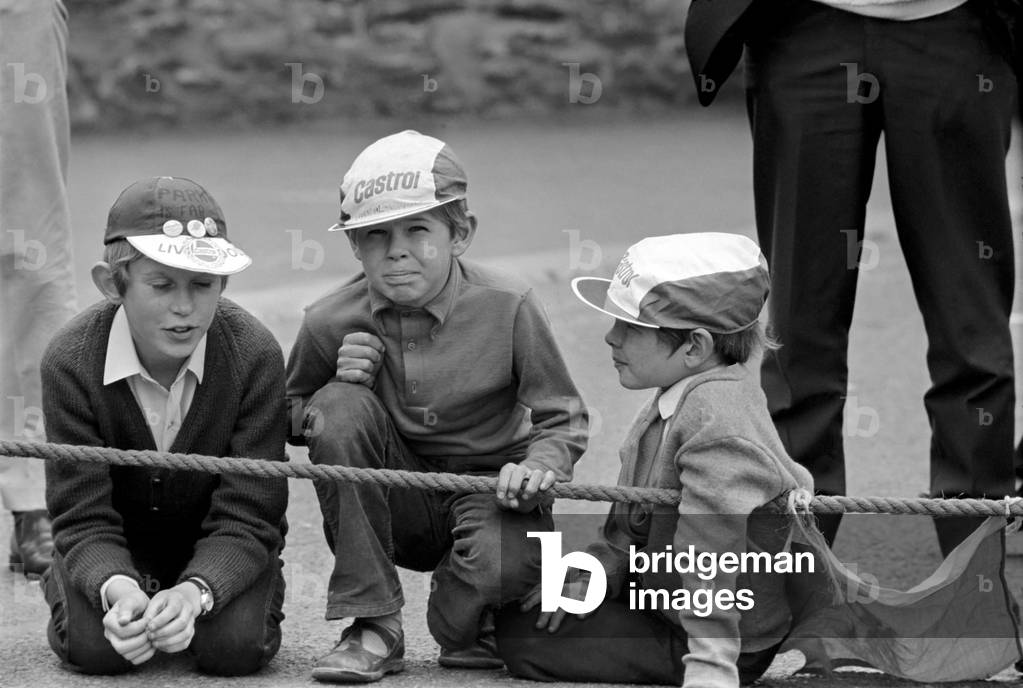 I.O.M. TT Races. Three young racing fans wait for the start 750cc Production Race. June 1971