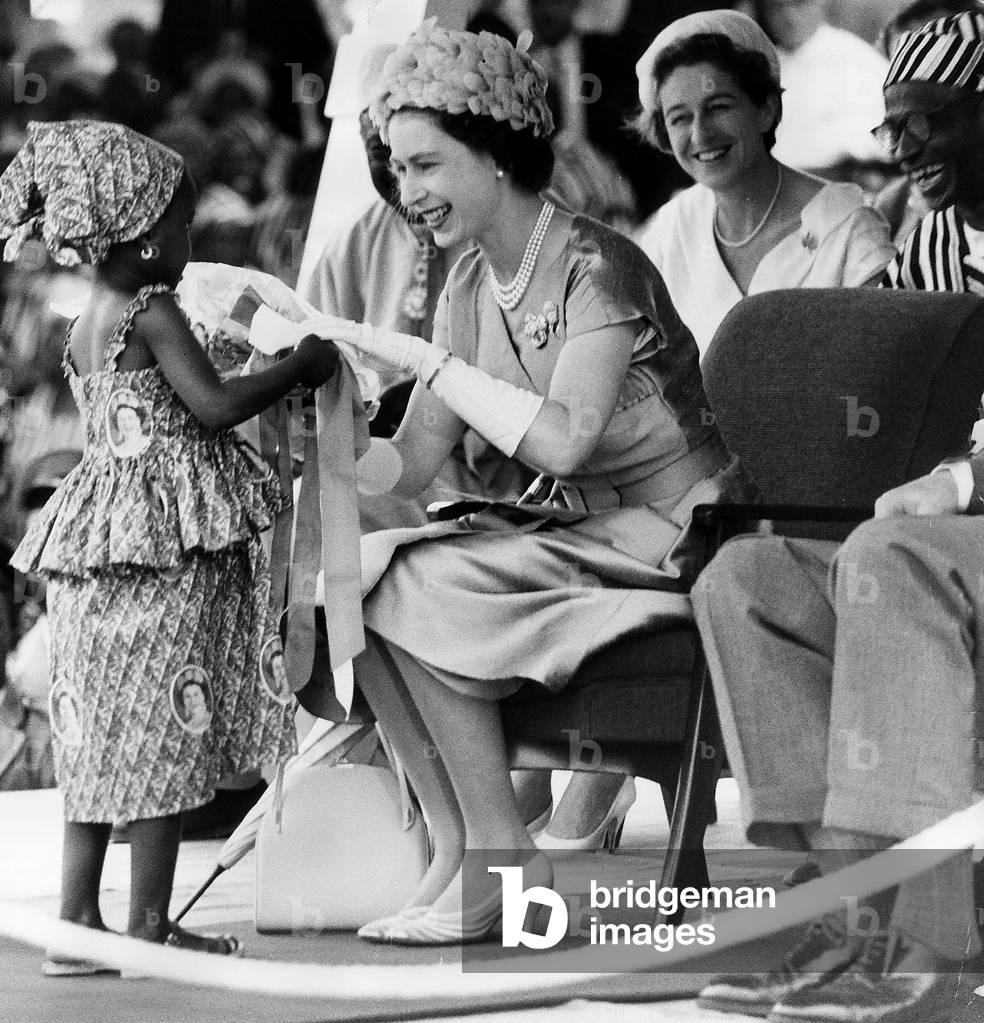 Her Majesty Queen Elizabeth II receives a bouquet with ribbons from Mamawo Kaikai, 30th November 1961 (b/w photo)