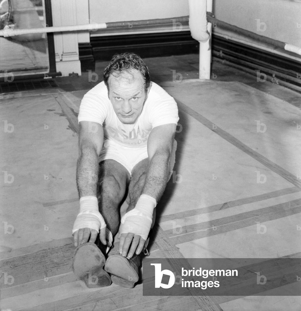 Former British Heavywight Boxing Champion Henry Cooper today had his first gym work-out since his cartilage operation at the Thomas A Beckett Gymnasium in the Old Kent Road. Henry plans to make his comeback to the ring at the Wembley Pool in March. He has been doing exercises at Arsenal to build up his knee which he injured when training for a fight