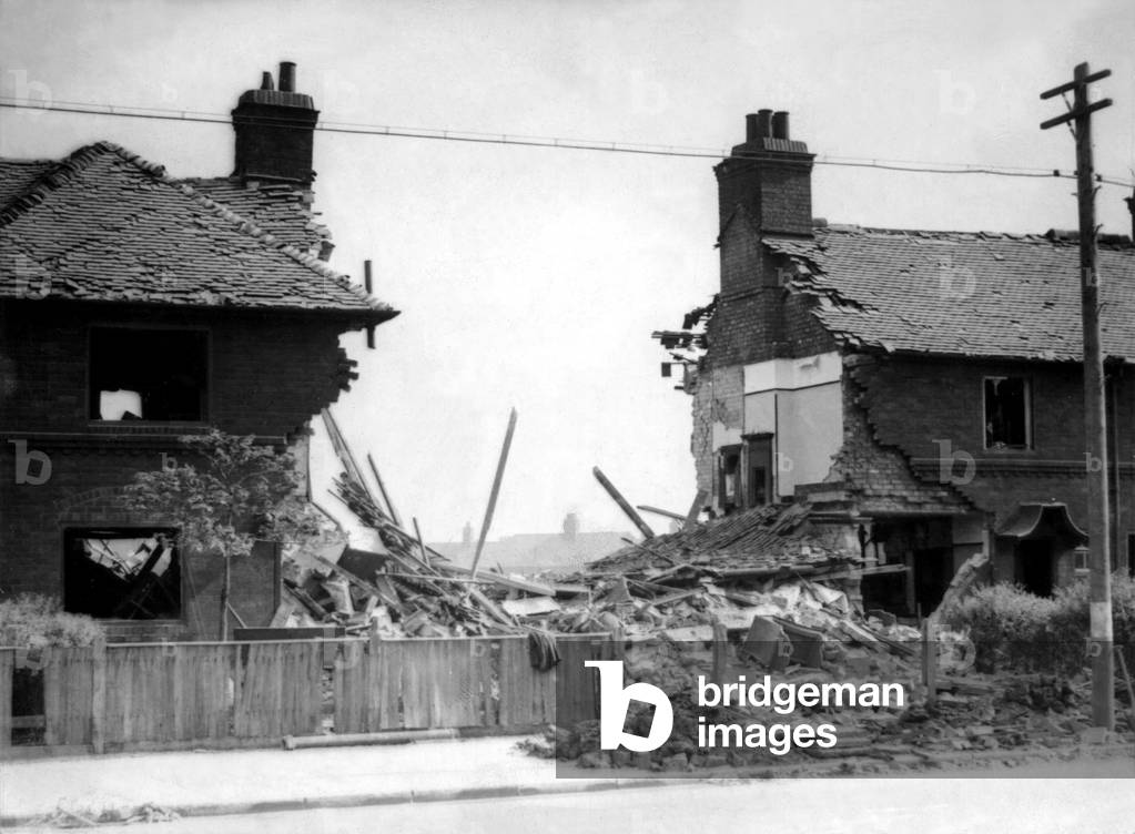 Second World War - The ruins after a German air raid on a North East of England town. Houses in Haverton Hill near Middlesbrough which were destroyed in a raid on 7th July, 1942 (b/w photo)