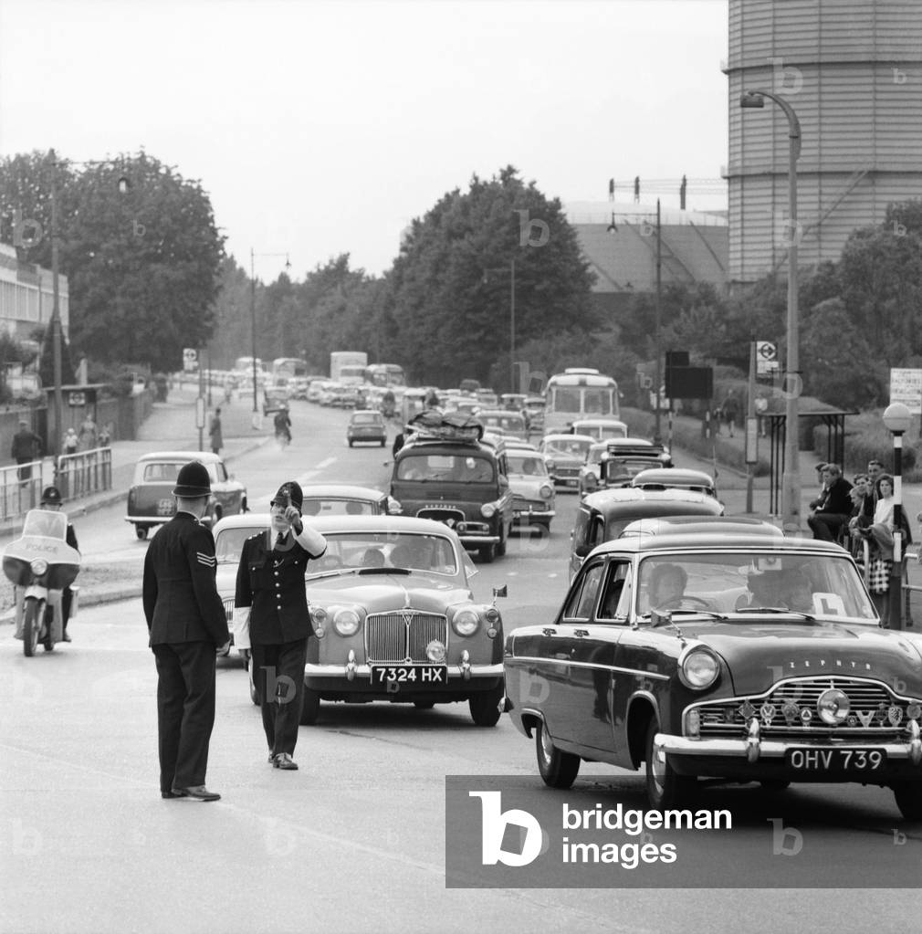 Traffic at Staines Bridge returning from the coast on a hot summer day.