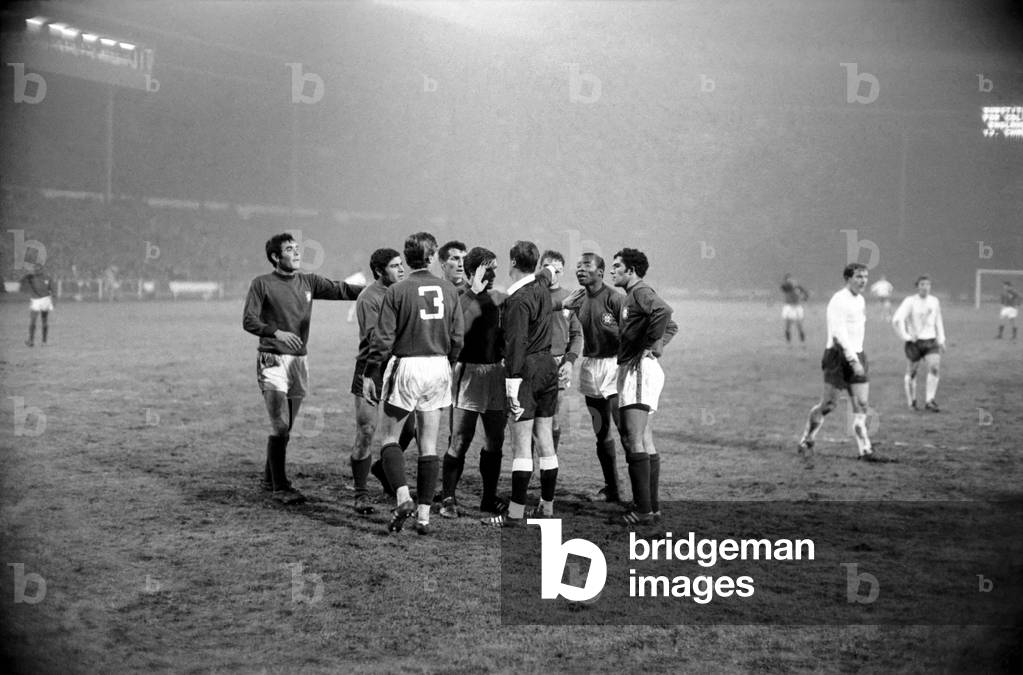 England's v. Portugal. Penalty! French referee Mouton wards off angry Portugese protests. January 1970 (photo)