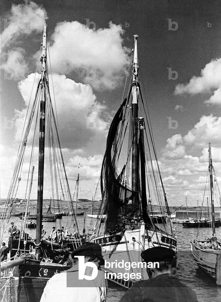Brittany France Fishermen from a fishing village on the south coast of Brittany dry their nets by hanging them from the masts of their boats., c. 1954 (b/w photo)