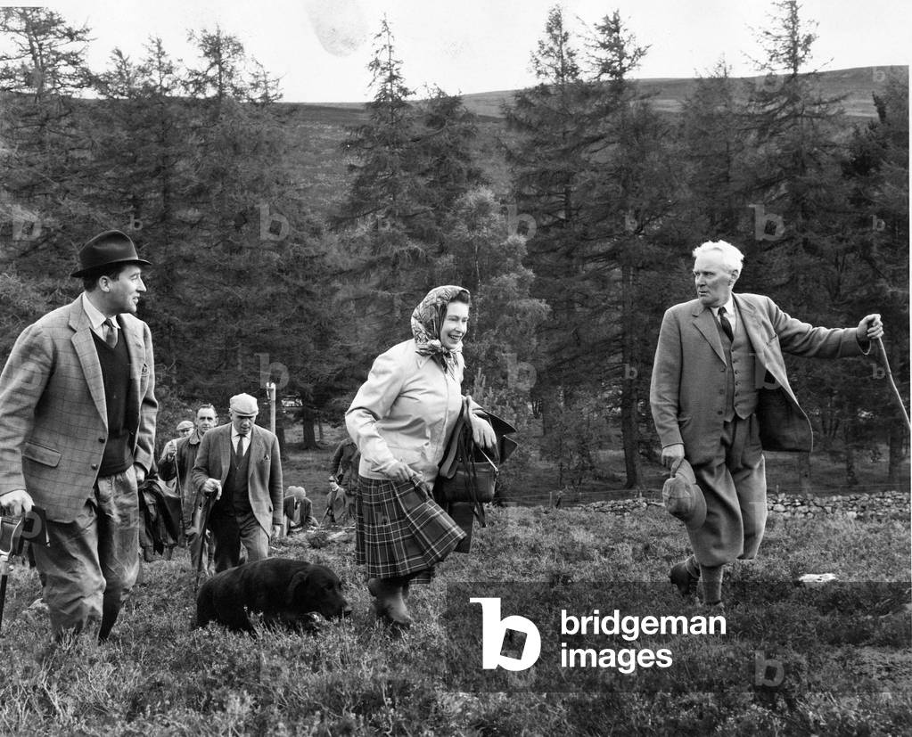 Queen Elizabeth II with her dog Wren at the North of Scotland Gun Dog Association Retriever Trials on Deeside, 5th October 1967