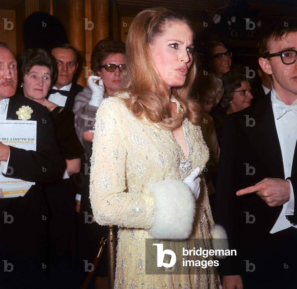 Ursula Andress and Woody Allen at the Royal premiere of the film Born Free March 1966 (b/w photo)