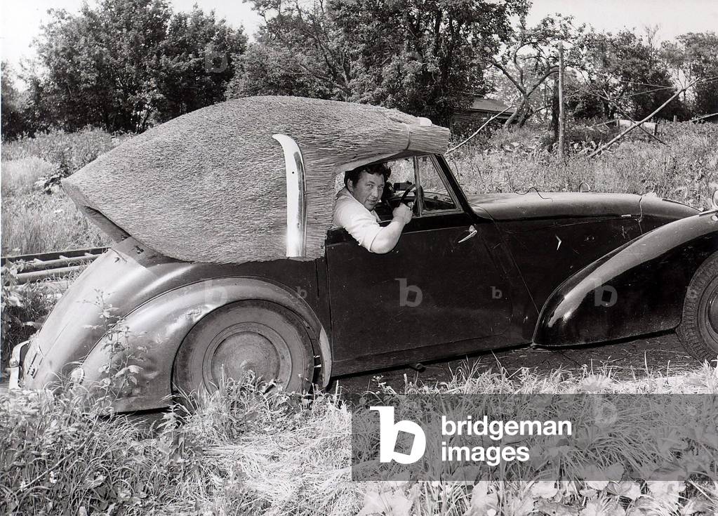 John Porter, a thatcher by trade, has made a thatched roof for his 1949 Allard which he bought for £20 in 1962
May 1964