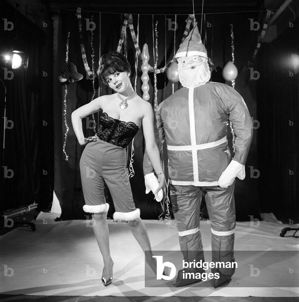 Model Kim Tracy seen here dressed for the office Christmas Party, 1960 (b/w photo)
