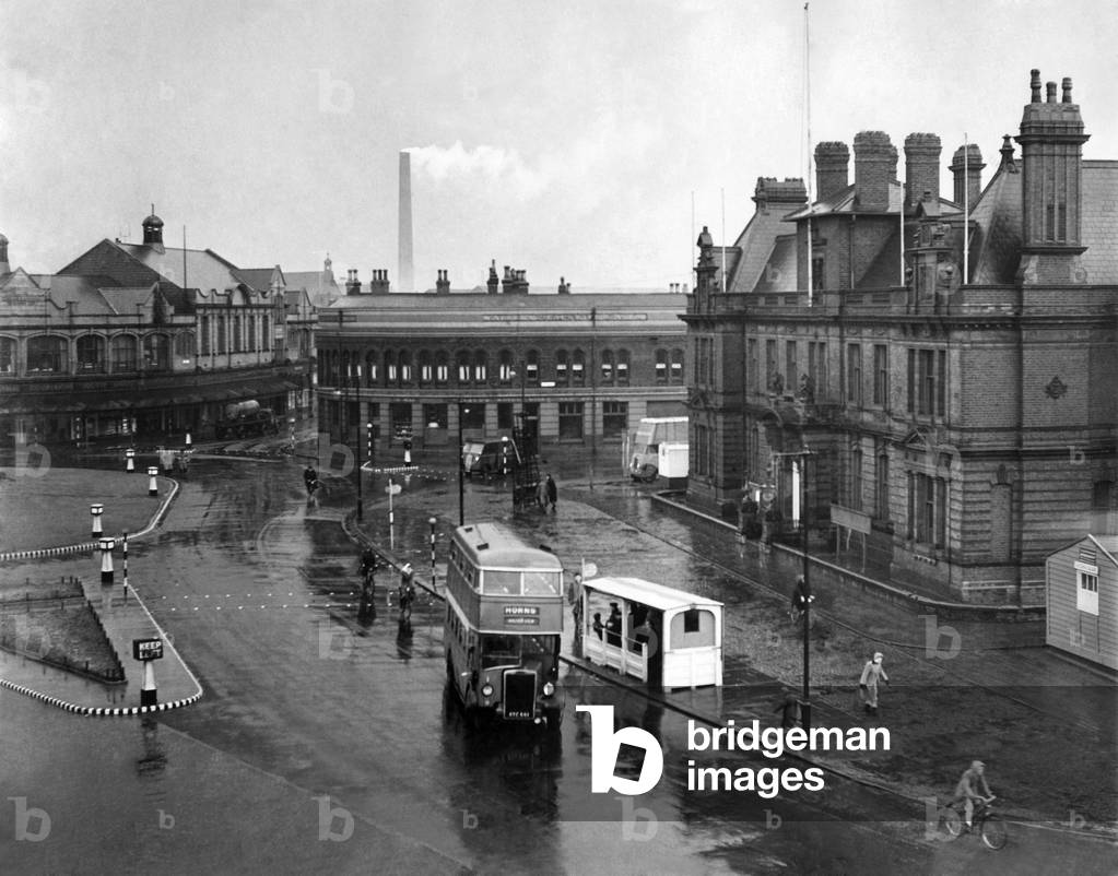View of the Civic centre in central London with bus passing by. 
November 1950
