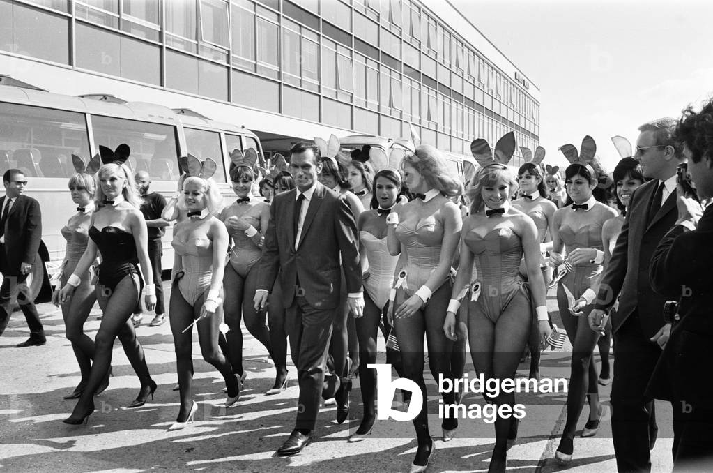 Hugh Hefner Boss of the Playboy Empire arrives with an entourage of Bunny Girls at London Heathrow Airport, Saturday 25th June 1966.