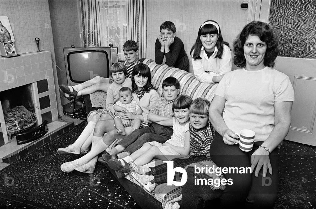 Pamela Spence and family, recently moved home to Arthur Street, Small Heath, Birmingham, 7th October 1969 (b/w photo)