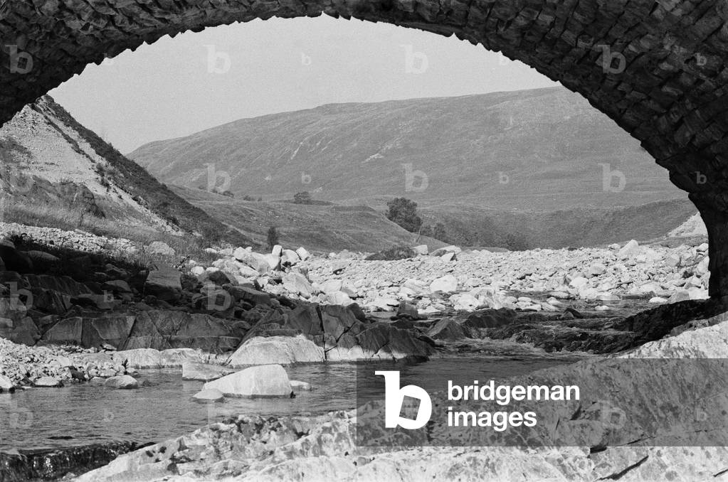 A view underneath a stone bridge at Glen Roy in Invernesshire in the Highlands of Scotland, c. 1960 (b/w photo)