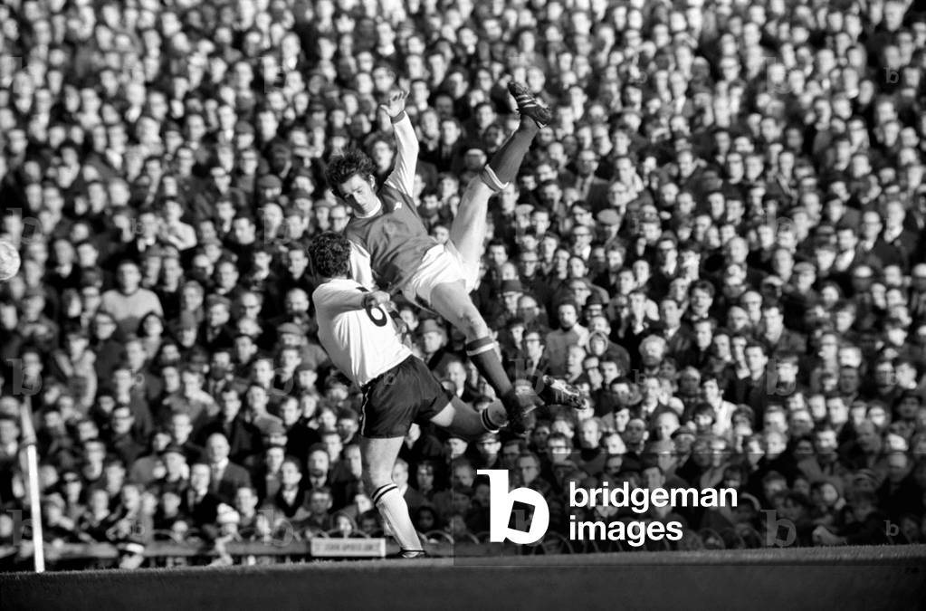 English League Division One match at HighburyArsenal 4 v Derby County 0. Derby's Captain Dave Mackay makes a back for Arsenal's Robertson. November 1969 (photo)
