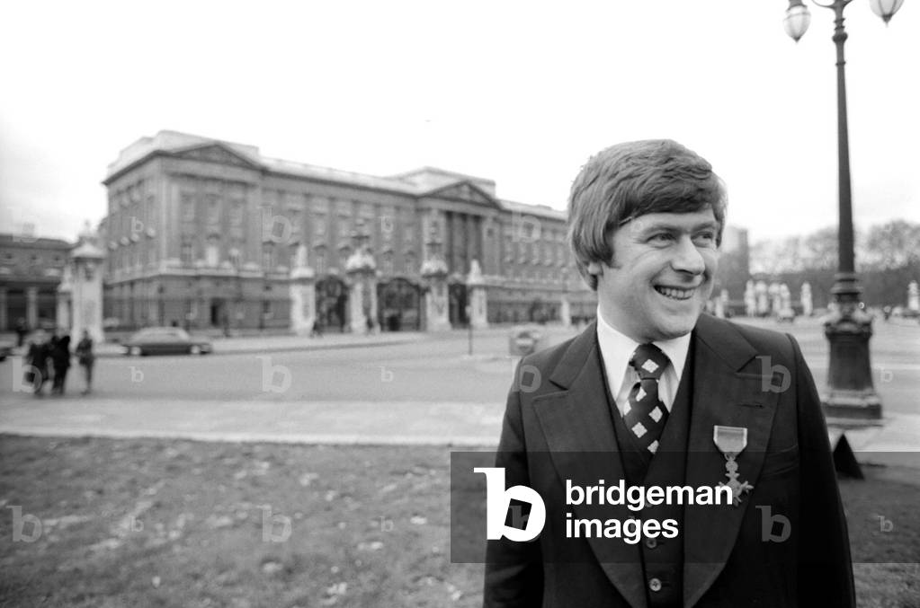 Mike Yarwood outside Buckingham Palace after receiving the O.B.E, December 1976 (b/w photo)