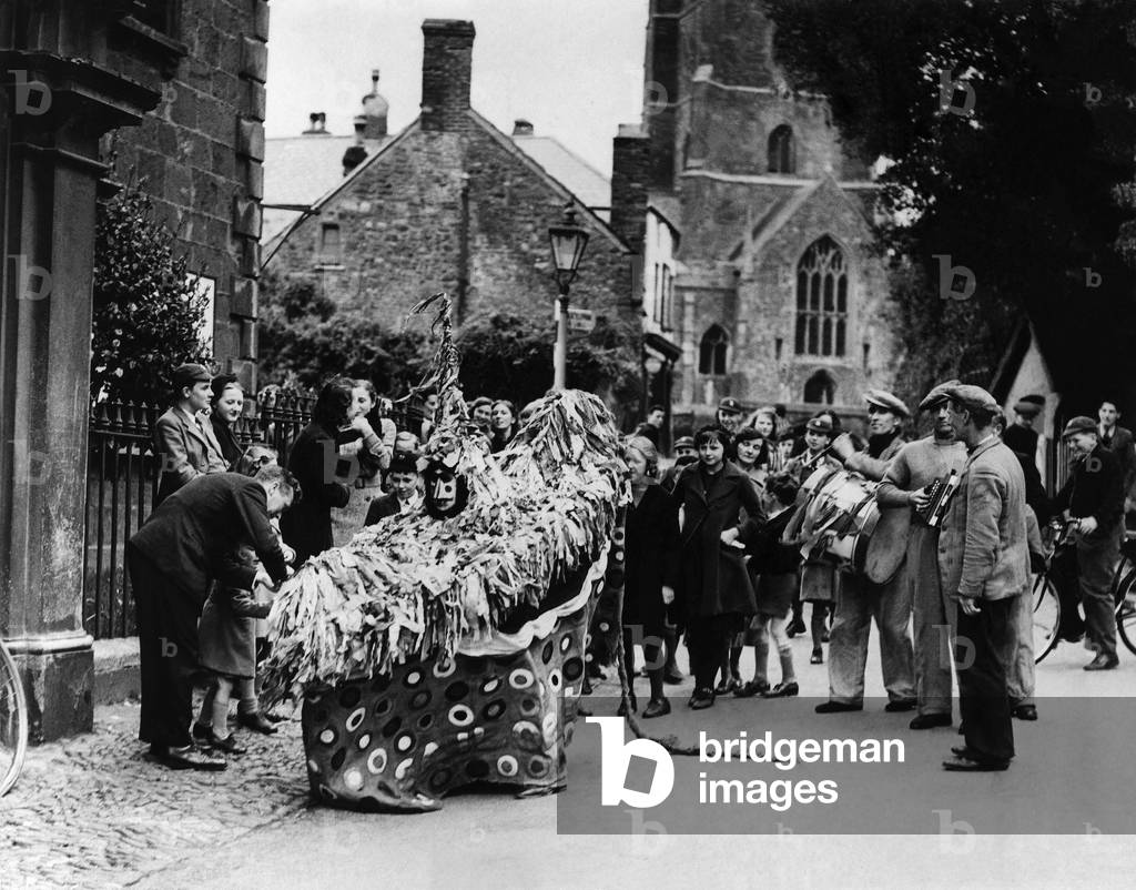 Men Preparing the hobby horse. May 1940 (b/w photo)