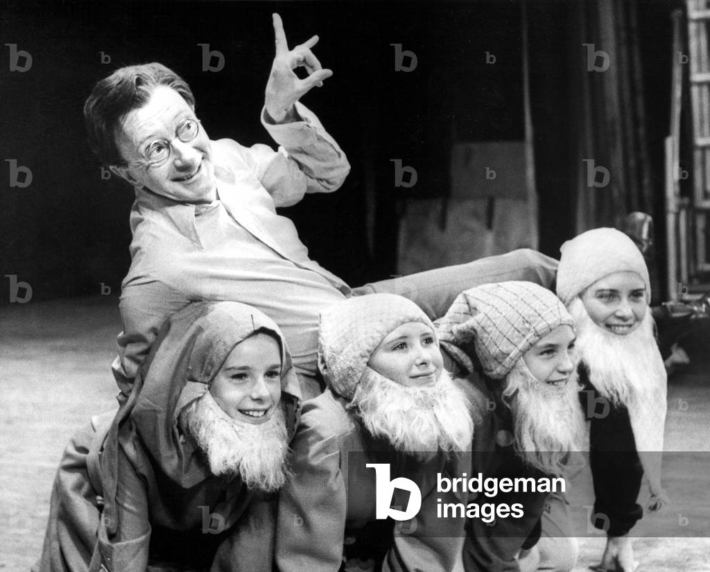 Actor, comedian and Carry On star, Charles Hawtrey, who was appearing at the Empire Theatre, Sunderland, in the pantomine 'Snow White and the Seven Dwarfs'. (Front row left to right) Beverley Patterson(10) Andrea Fairweather (11) Philippa Carter (10) & Yvonne Scott (14) 10th November, 1975 (b/w photo)