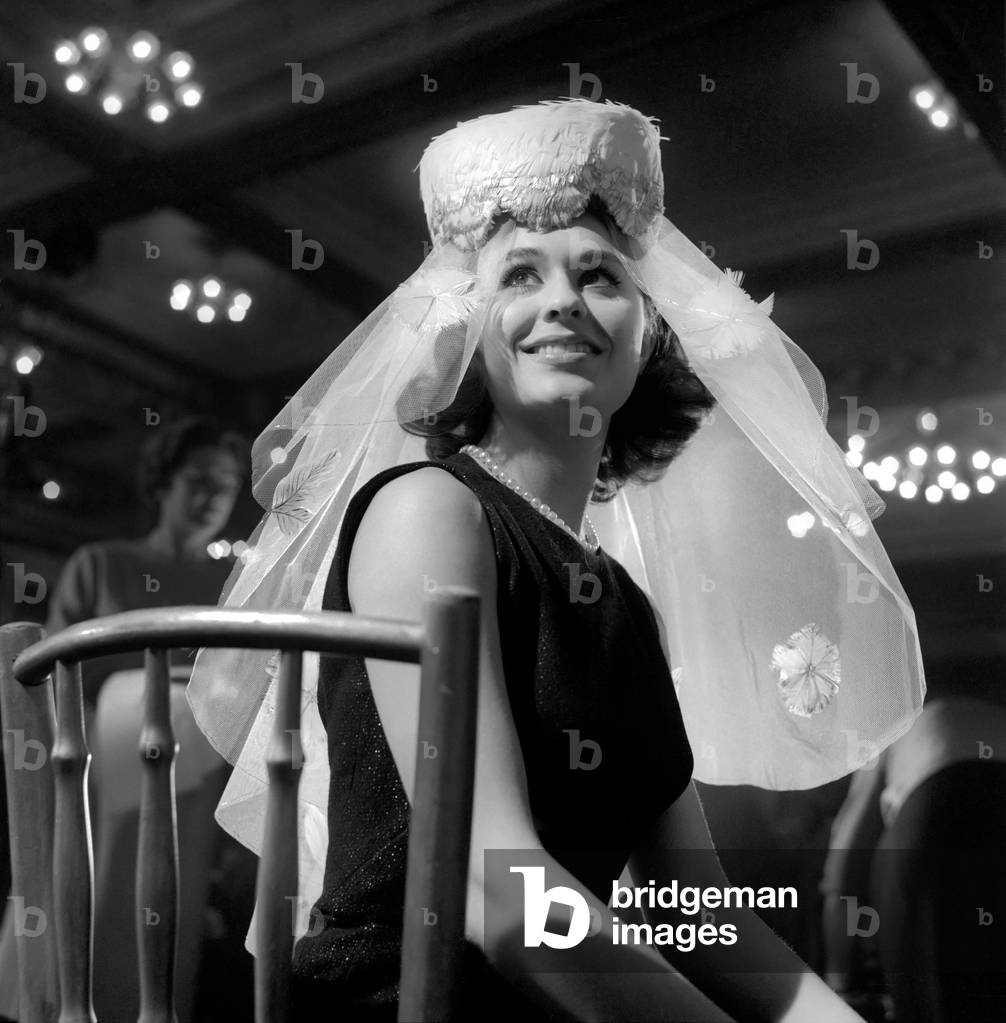 At the Cafe Royal, Regent St. the 5th Annual Festival of Poultry Feather Hats was held - there were two classes Fashion Hats and Zany Hats, both classes were judged Otto Lucas the well known milliner. All the hats were entered by amateurs in a nation-wide competition which will be featured at the International Poultry Show (Olympia London), November 1963 (b/w photo)