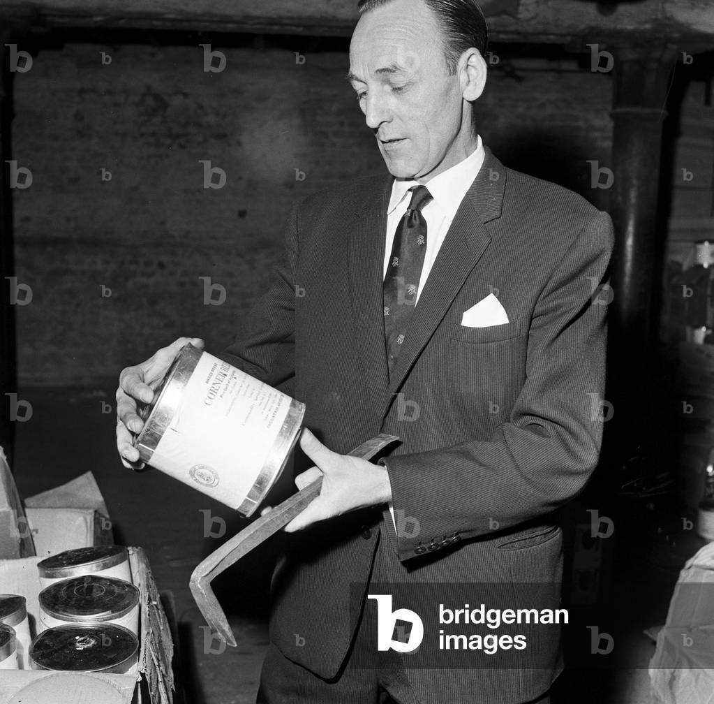 Typhoid outbreak. Aberdeen. Scotland. 1964. In 1964 there was an outbreak of typhoid in the city of Aberdeen, Scotland. The first two cases were identified on 20 May 1964; eventually over 400 cases were diagnosed and the patients were quarantined at the City Hospital in Urquhart Road, but no fatalities resulted. The outbreak was eventually traced to contaminated tinned corned beef from South America made by Fray Bentos and sold in the city's branch of the Scottish grocery chain William Low. The infected meat then contaminated a meat slicing machine within the William Low shop, leading to the spread of the disease. Pictured. Discarded Tins of corned beef from Argentina, 31st May 1964 (b/w photo)