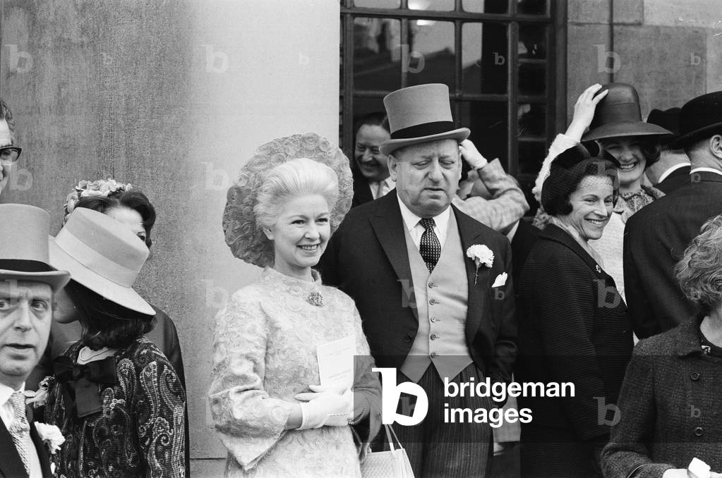 The wedding of Michael Grade, twenty four year old son of Leslie Grade, and his bride Penelope Levinson at St John's Wood Liberal Synagogue. Here the groom's brother Lew Grade with his wife. 19th March 1967 (b/w photo)